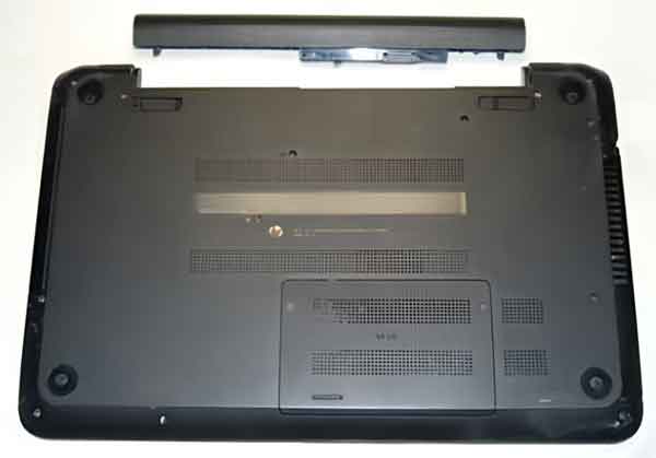 A laptop computer with a battery that is accessible from the bottom