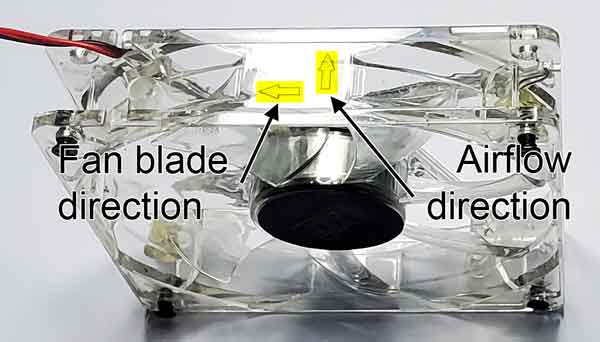 Photo of a case fan with directional arrows highlighted